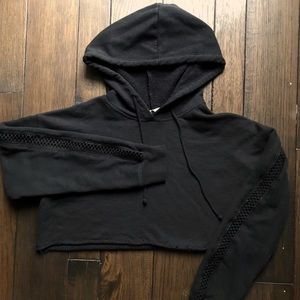Cropped black hoodie with detailed sleeves